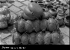 pottery in a rope net ready to go to market