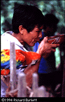 drinking chicha from a pottery mucawa